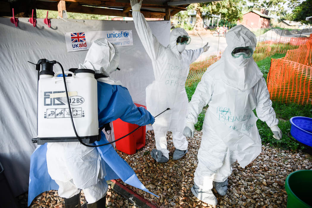 Medical staff of the Ebola Treatment Unit (ETU) get ready to work in their Personal Protective Equipment (PPE) during their weekly rehearsal at the Bwera General Hospital in Bwera bordering with DRC, western Uganda, on December 12, 2018.