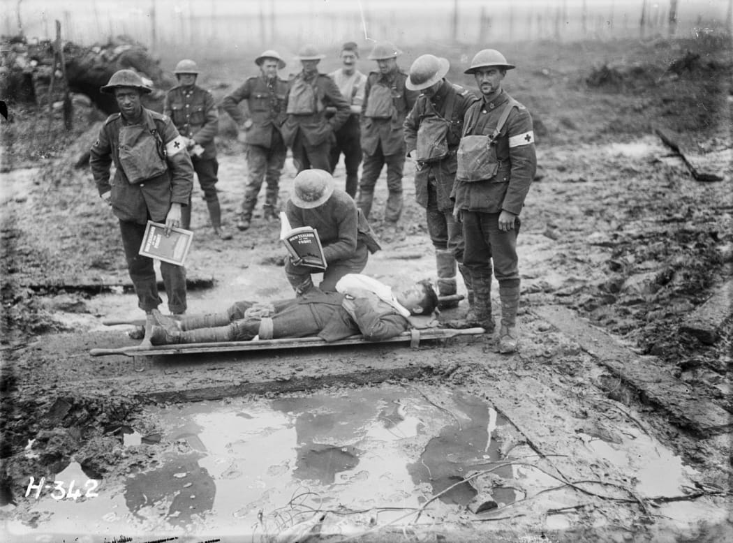 A wounded NZ soldier on a stretcher in Belgium, late 1917.