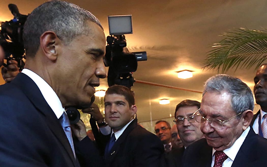 Cuban President Raul Castro and US President Barack Obama shake hands in Panama City.