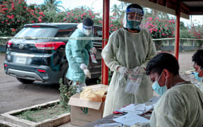 Front-line workers at the swab drive-through in Vunimono, Nausori.