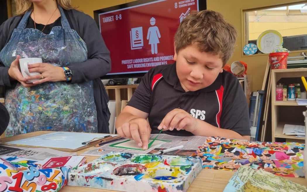Stratford Primary student Ostyn Marriner takes part in the art workshop at Beyond COP21 Symposium.