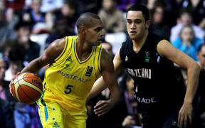 Australian Boomers guard Patty Mills in action against New Zealand's Izayah Mauriohooho-Leafa in 2013