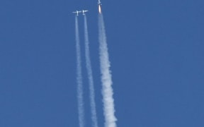 Virgin Galactic's VSS Unity launches for a suborbital test flight on December 13, 2018, in Mojave, California. - Virgin Galactic marked a major milestone on Thursday as its spaceship made it to a peak height, or apogee, of(82.7 kilometers),