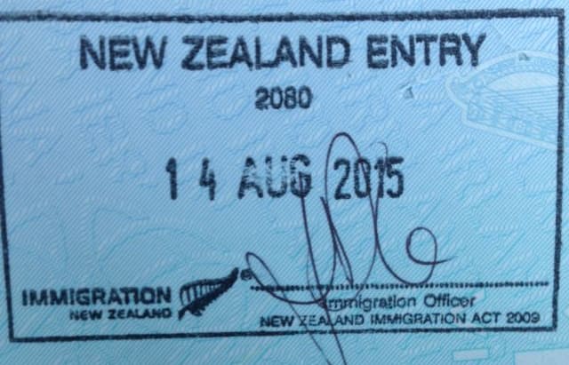 An image of a stamp in a passport, confirming residency in New Zealand.
