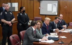 NEW YORK, NEW YORK - APRIL 04: Former U.S. President Donald Trump sits at the defense table with his defense team in a Manhattan court during his arraignment on April 4, 2023, in New York City. Trump was arraigned during his first court appearance today following an indictment by a grand jury that heard evidence about money paid to adult film star Stormy Daniels before the 2016 presidential election. With the indictment, Trump becomes the first former U.S. president in history to be charged with a criminal offense.   Seth Wenig-Pool/Getty Images/AFP (Photo by POOL / GETTY IMAGES NORTH AMERICA / Getty Images via AFP)