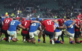 Manu Samoa and England players join for a prayer post-match.