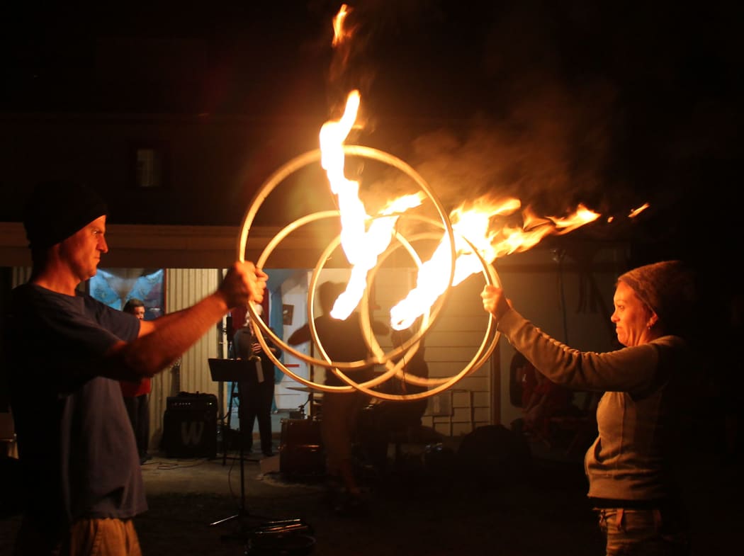 Concentration; Andy and Felicity and their  flaming bike wheel routine