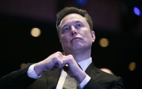 Elon Musk looks on as US President Donald Trump speaks at the US-Saudi Investment Forum at the John F. Kennedy Center for the Performing Arts in Washington, DC on November 19, 2025. (Photo by Brendan SMIALOWSKI / AFP)
