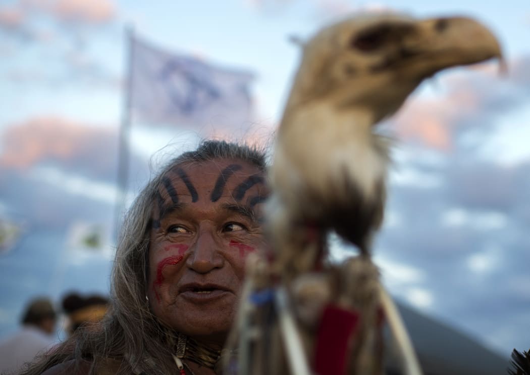 Phil Little Thunder Sr attends an evening gathering at an encampment where hundreds of people have gathered to join the Standing Rock Sioux Tribe's protest against the construction of the Dakota Access Pipeline.