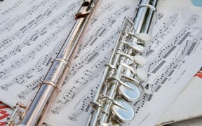 Flutes on music manuscript.