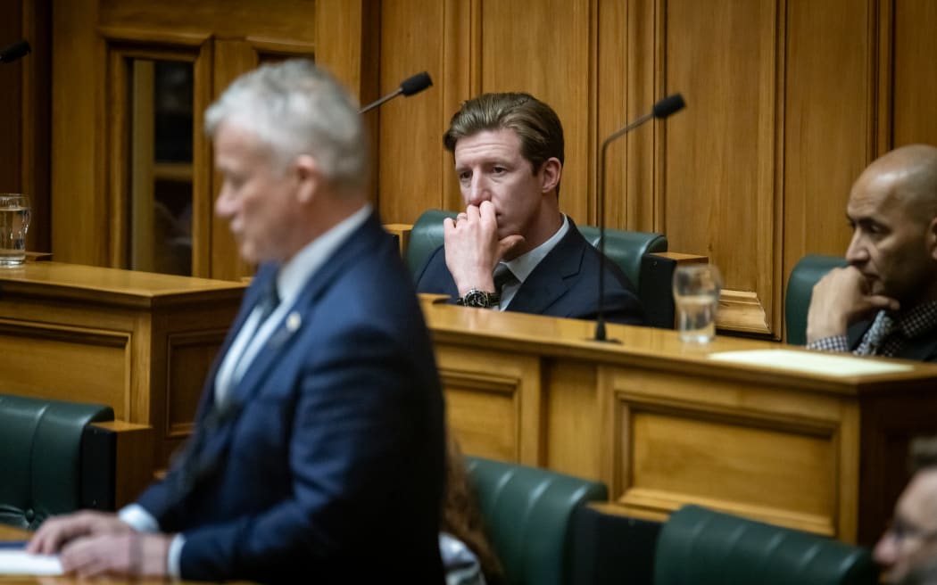 Question Time can look boring for the back bench. National MPs Sam Uffindel and Tama Potaka stare into the middle distance as ACT's Chris Baillie gets a question.