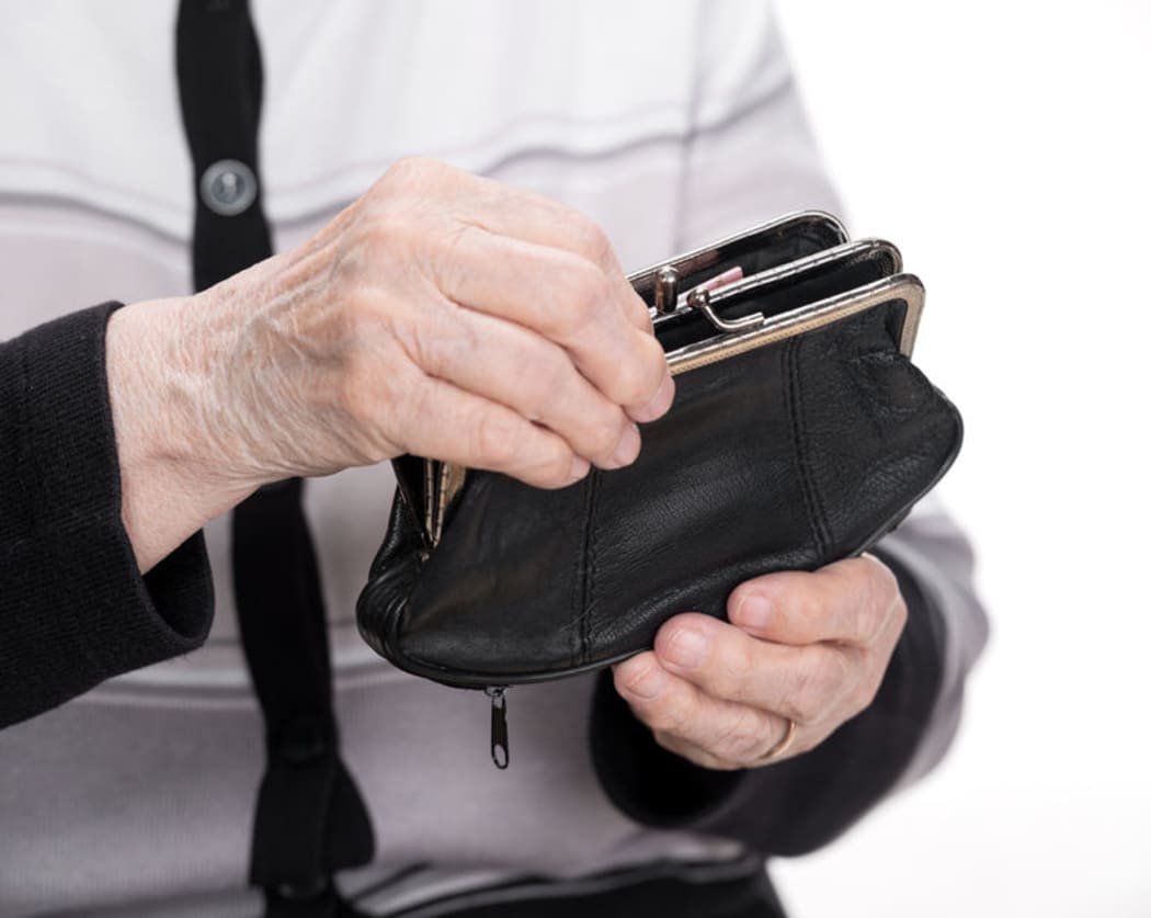 Elderly woman holding person