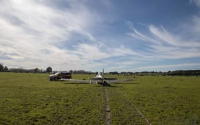 North American Harvard NZ1015 in an emergency landing adjacent to RNZAF Ohakea Base.