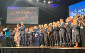 National's 2023 election campaign candidates stand on stage at the party's national conference in Wellington.