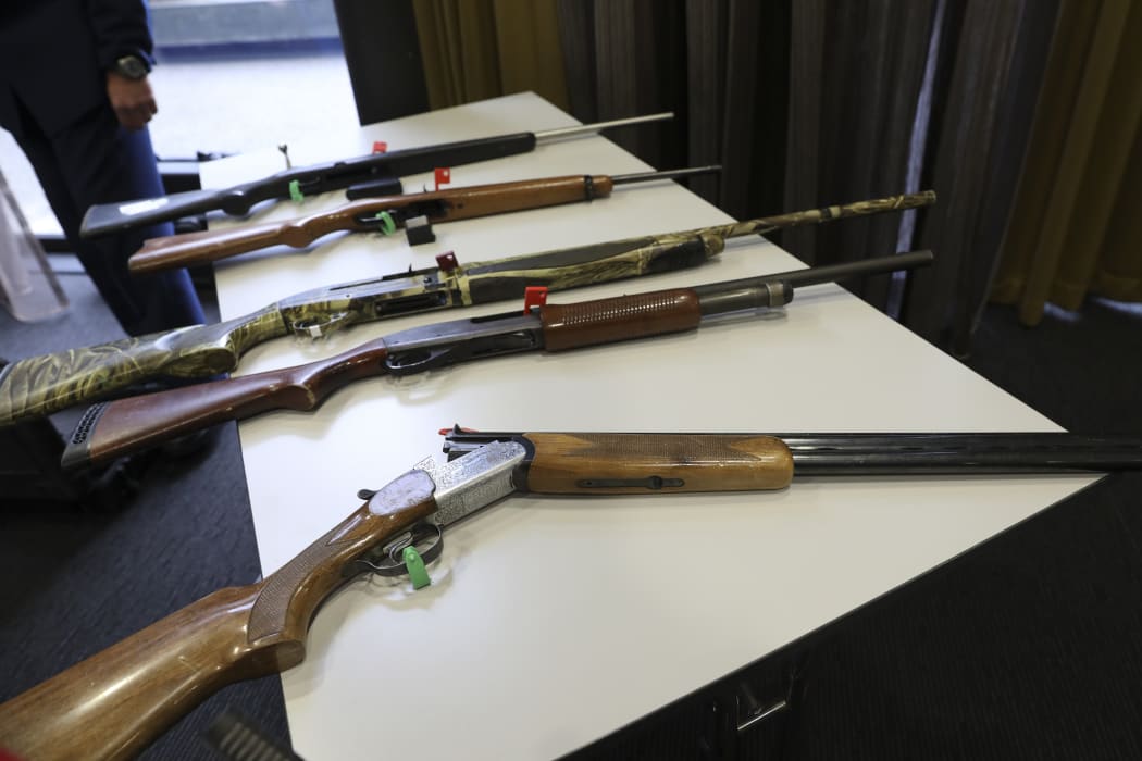 Firearms that will remain legal, depending on number of rounds and magazine type, on display at the police press conference.