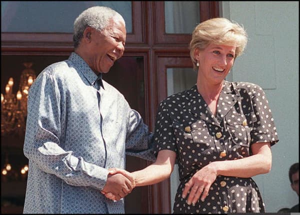 South African President Nelson Mandela (L) and Princess Diana speak with the press after meeting in the Mandela's home, Goldendale, in Cape Town, South Africa 17 March.  It is Diana's first public appearance since her arrival in South Africa last week to visit her brother Charles Spencer.