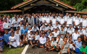 The Flying Fijians with villagers of Somosomo village in Taveuni after their Sunday service on 2 July 2023.