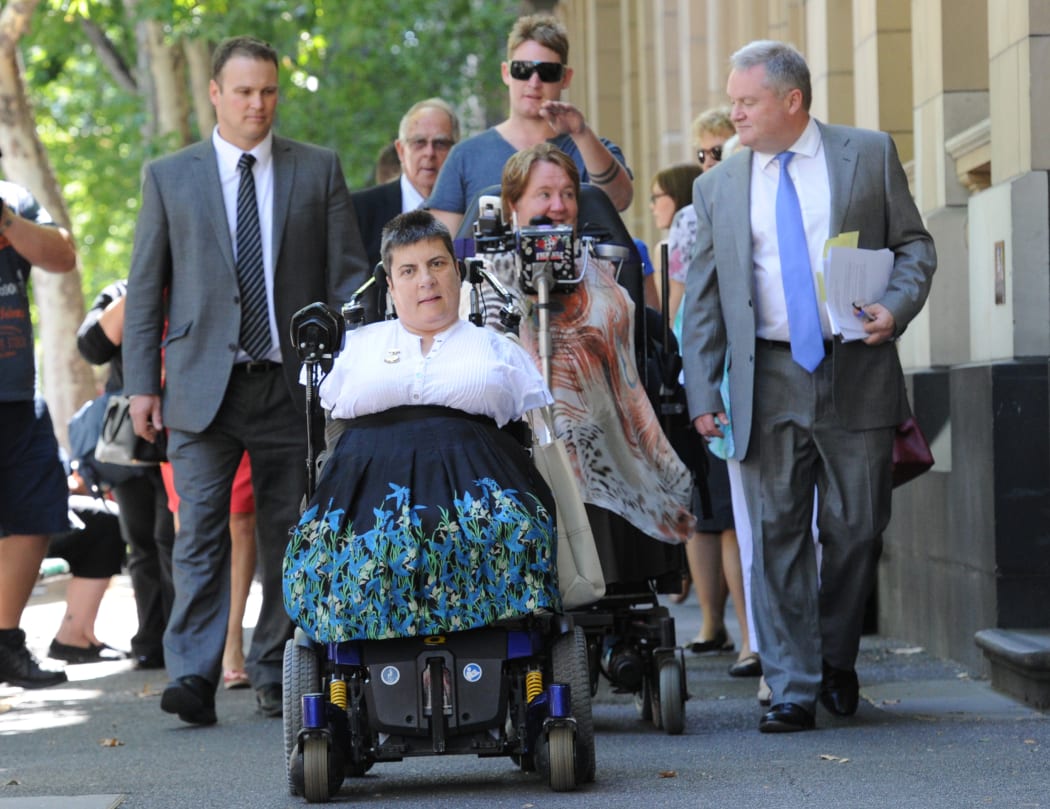 Thalidomide survivors Lynette Rowe (front) and Monica McGhie leave court.