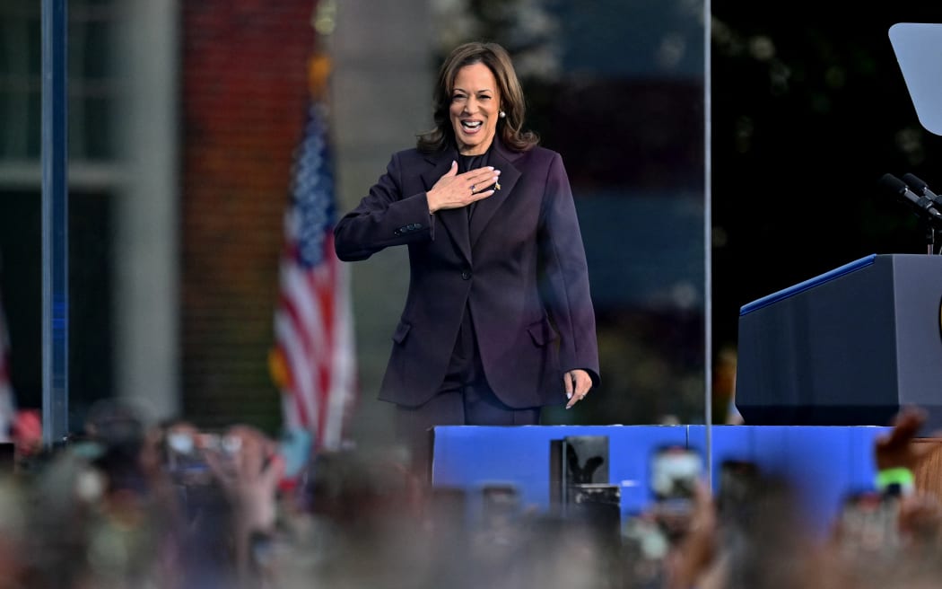 US Vice President Democratic presidential candidate Kamala Harris gestures at supporters as she arrives to speak at Howard University in Washington, DC, on November 6, 2024. - Donald Trump won a sweeping victory on November 6, 2024 in the US presidential election, defeating Kamala Harris to complete an astonishing political comeback that sent shock waves around the world. (Photo by ANGELA WEISS / AFP)