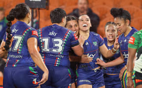 Warriors winger Payton Takimoana celebrates her third try with teammates.
NZ Warriors v Canberra Raiders.