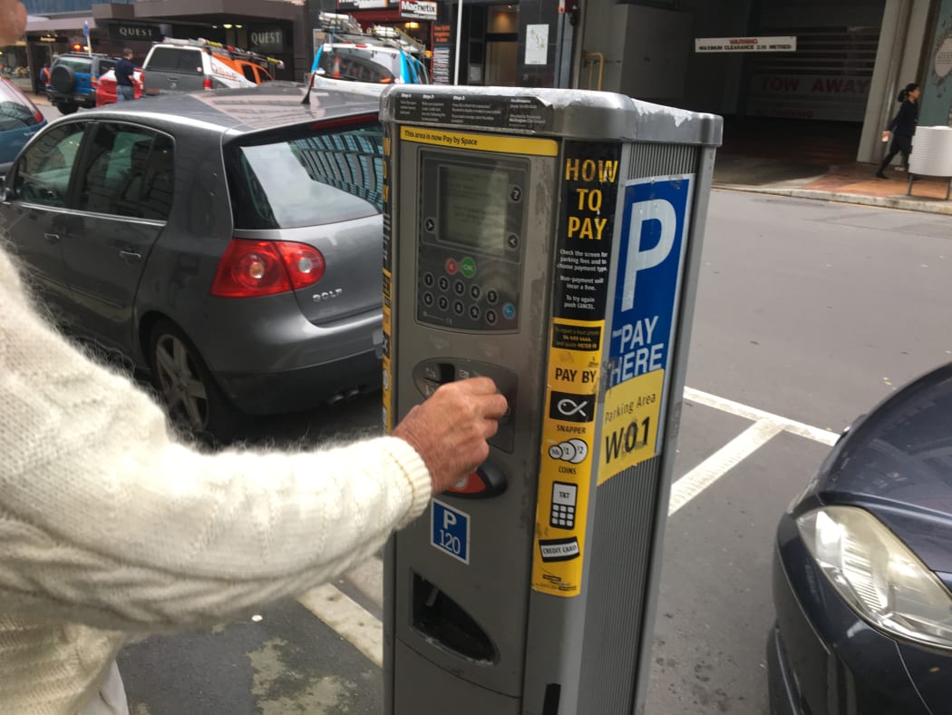 A file photo of someone paying for parking in Wellington's CBD