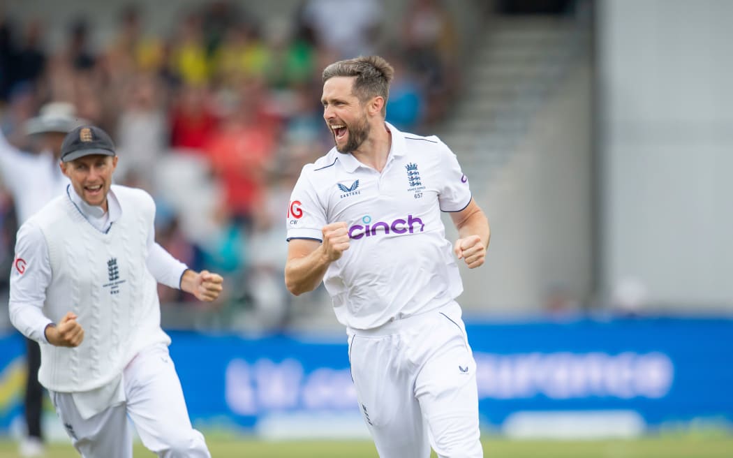 England's Chris Woakes celebrates a wicket.