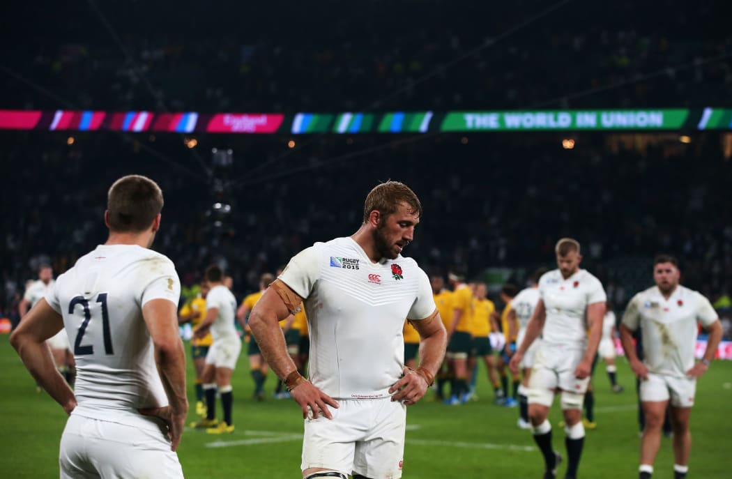 Chris Robshaw of England looks dejected with team mates after their loss to Australia.