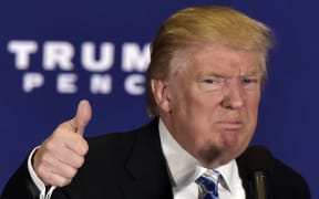 Republican presidential nominee Donald Trump gives the thumbs-up after speaking at a campaign event at the Eisenhower Hotel in Gettysburg, Pennsylvania on October 22, 2016.