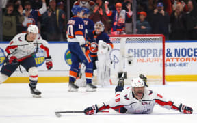 Alex Ovechkin of the Washington Capitals celebrates after scoring his 895th career goal to become the NHL all-time lead goal scorer.