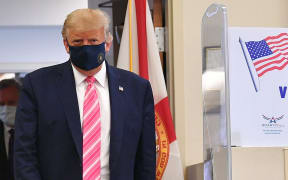 Donald Trump leaves the polling station after casting his ballot at the Palm Beach County Public Library, during early voting for the 3 November election.