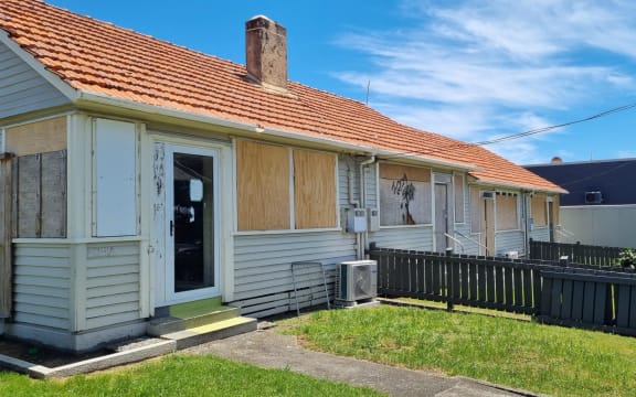 The boarded up flats on Dawson Street enjoy seasviews and are neighboured by modern townhouses. Former mayor Peter Tennent is developing two buildings across the road including one which will house a family apartment overlooking the Tasman Sea.