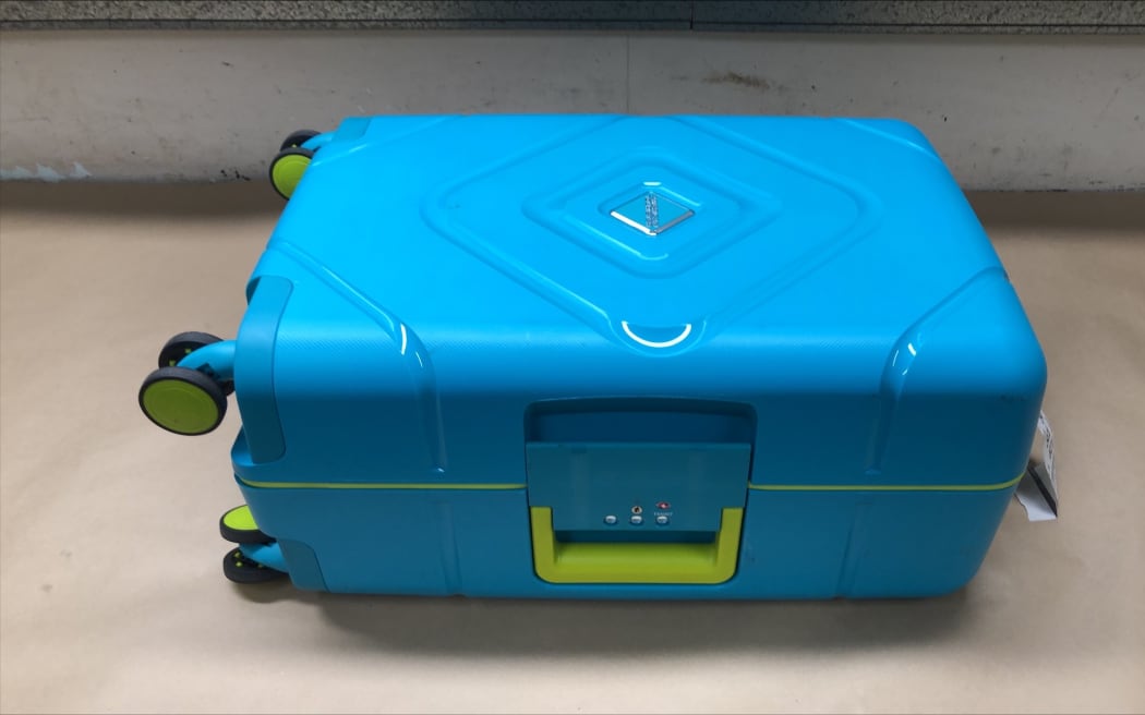 The suitcase containing concealment of methamphetamine.