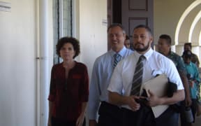 Police Commissioner, Fuiavailili Egon Keil, in the middle heading to court with his lawyer (right) a family supporter and civilian police officers behind.