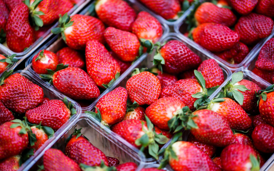 Strawberries in plastic container.