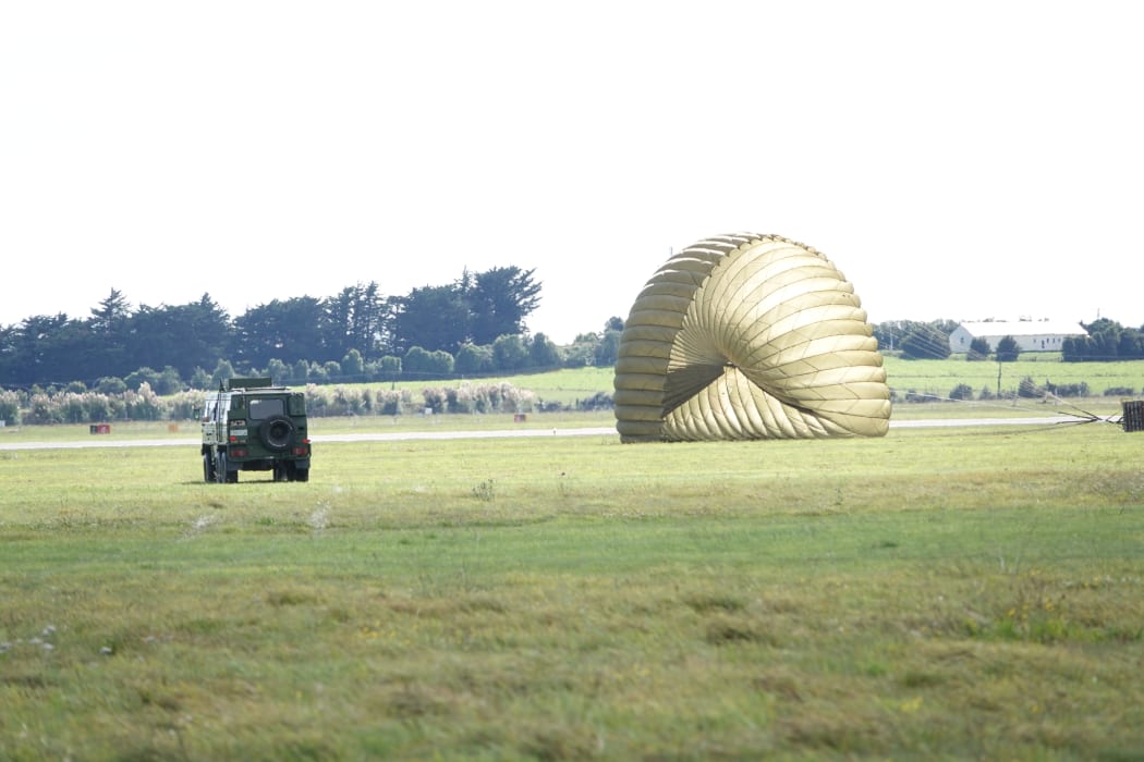Supplies fall to the ground at Ōhakea air base.