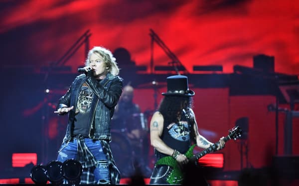 Axl Rose lead singer, and Slash, guitarist with Guns N' Roses, perform during a concert at the Friends Arena in Stockholm, Sweden, on June 29, 2017.