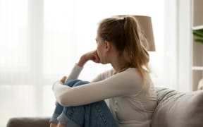 Anxious young woman at home. (File image)