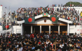 Bangladeshi people are celebrating at the country's Prime Minister Sheikh Hasina's office after she fled and resigned in Dhaka, Bangladesh, on August 5, 2024.