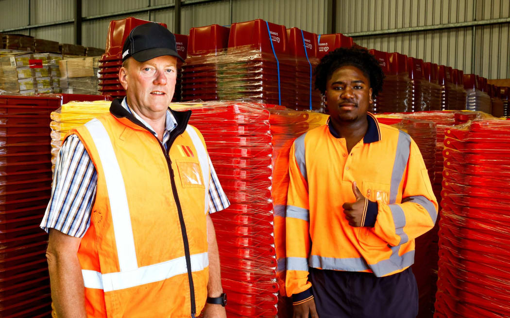 WM New Zealand Marlborough branch manager Paul Withers, left, with Nike Alvarez who is helping with the wheelie bin roll-out in Marlborough. SUPPLIED: MAIA HART/LDR - SINGLE USE ONLY