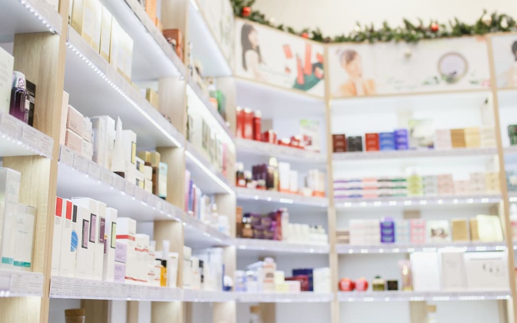Shelves with skin and hair care products in a cosmetic store