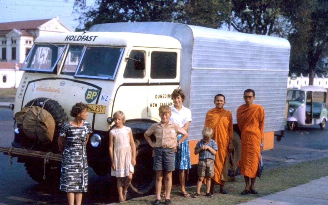 Five of the MacLeods with monks in Bangkok.