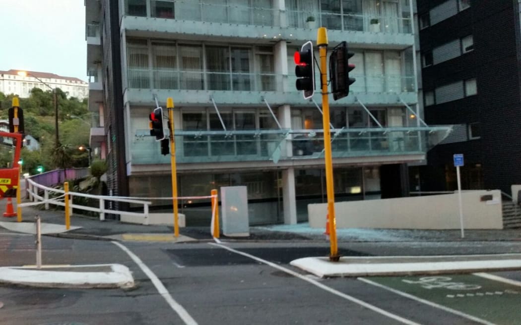 The remains of the large glass balcony after it fell off a high rise in central Wellington.