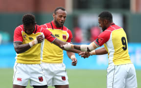 Papua New Guinea players celebrate a try against Jamaica.