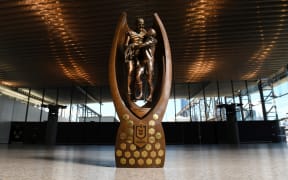 The NRL trophy featuring Norm Provan (left) and Arthur Summons.