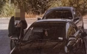 A person caught on CCTV filling up Chloe Mather's car with petrol.
