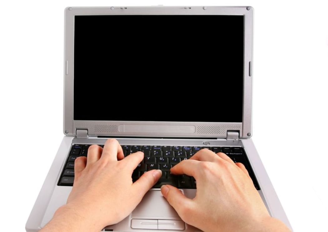 Woman typing on laptop
