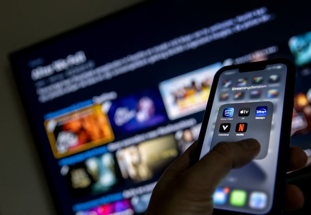2022-01-19 12:42:43 ILLUSTRATIVE - Applications from streaming services Disney Plus, Amazon Prime Video, Apple TV, Videoland and Netflix on a phone.