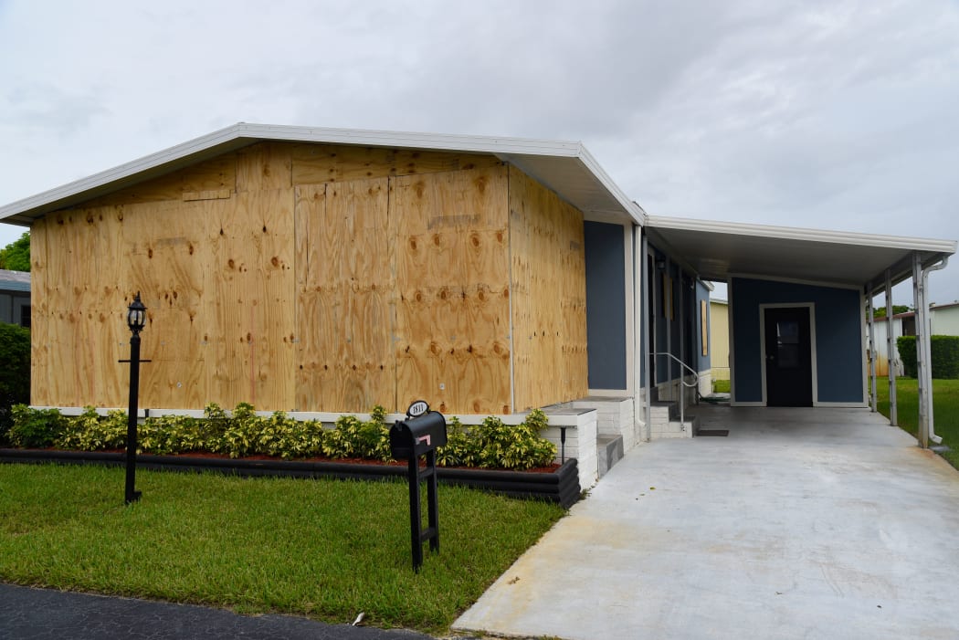 A boarded up house is seen in Deerfield Beach, Florida on September 2, 2019. -