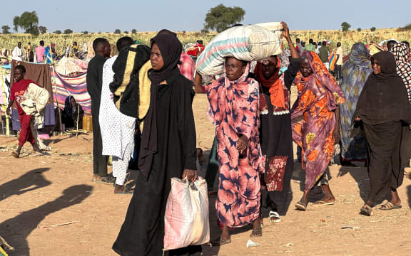 Displaced Sudanese who fled El-Fasher after the city fell to the Rapid Support Forces (RSF), arrive in the town of Tawila in war-torn Sudan's western Darfur region on 28 October, 2025.