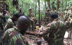 Australian soldiers are shown how to light a fire from scratch by their Papua New Guinea counterparts. August 2019